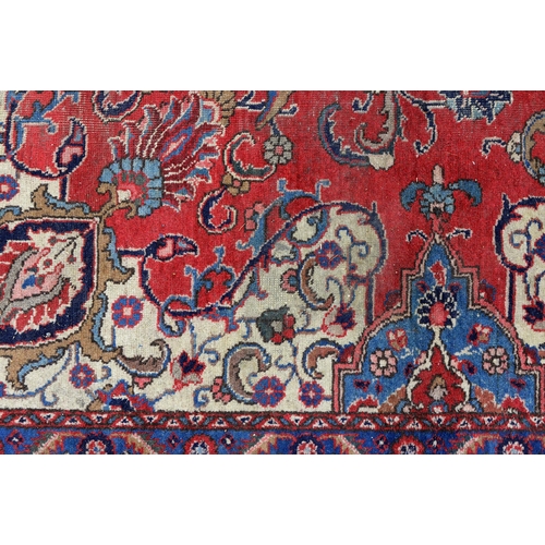 1291 - A red ground rug, 230 x 328cm