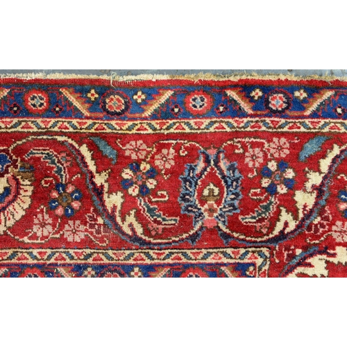 1291 - A red ground rug, 230 x 328cm