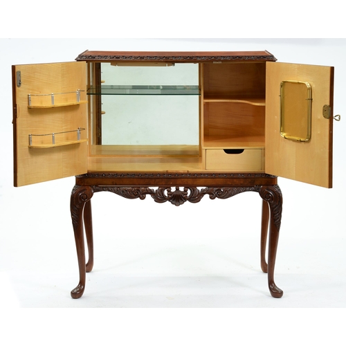 1296 - A walnut cocktail cabinet, mid 20th c, on carved cabriole legs, 116cm h; 45 x 93cm