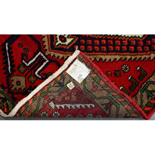 1345 - An antique rug, 106 x 130cm and another, 130 x 180cm (2)