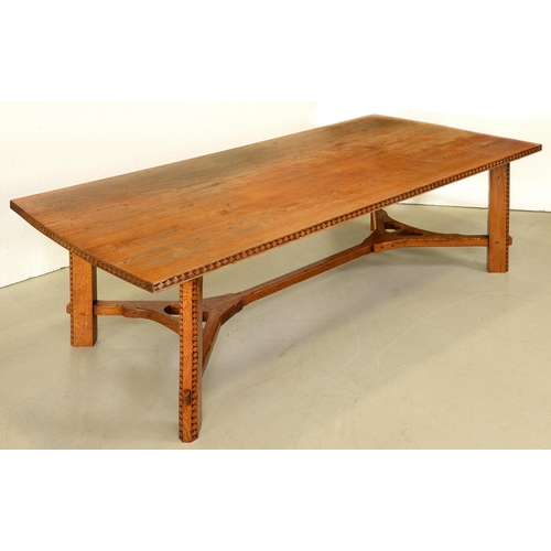 1351 - An oak hay rake table, in the manner of Ernest Gimson,  the three plank top with butterfly joints, t... 