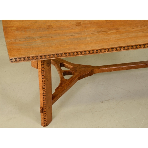 1351 - An oak hay rake table, in the manner of Ernest Gimson,  the three plank top with butterfly joints, t... 