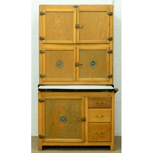 1360 - An early 20th c Hygena kitchen cupboard, with sliding enamelled work surface, the fitted interior wi... 