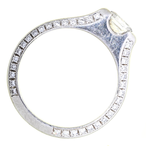 15 - A diamond ring, the octagonal diamond set in platinum, the sides outlined with diamond accents, 6.6g... 