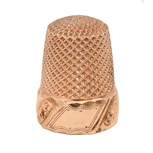 396 - A gold thimble, late 19th c, with vacant cartouche and  band of spiralling foliage, 19mm h, 3.9g+... 