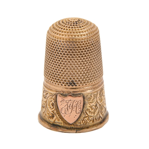 400 - A gold thimble, late 19th c, engraved with initials on an applied shield, 23mm h, 3g... 