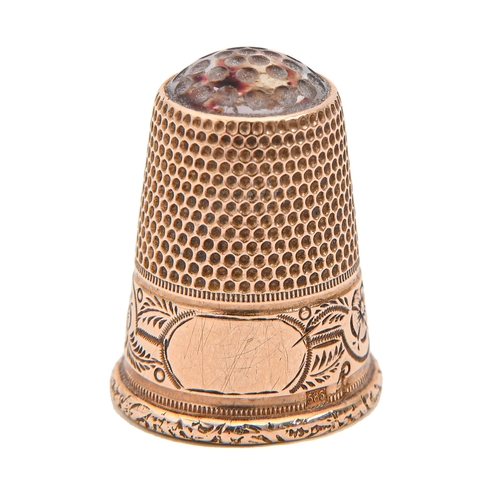 405 - A Victorian gold thimble, with amethyst glass top and foliate engraved border, 22mm h, 4.5g... 