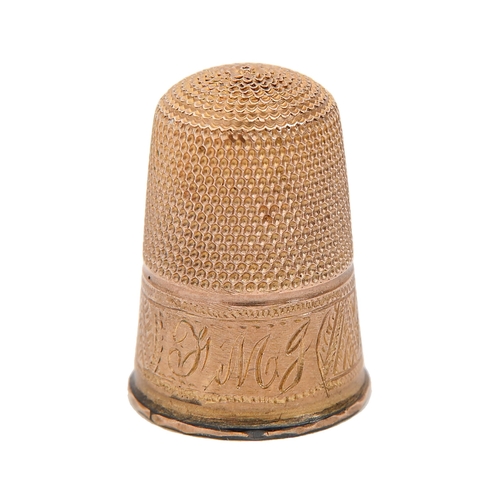 406 - A gold thimble, c1900, engraved with initials on a band of chevrons, 22mm h, contemporary plush line... 