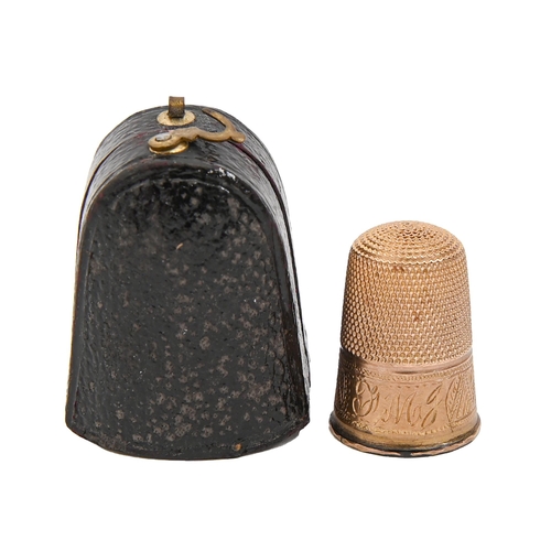 406 - A gold thimble, c1900, engraved with initials on a band of chevrons, 22mm h, contemporary plush line... 