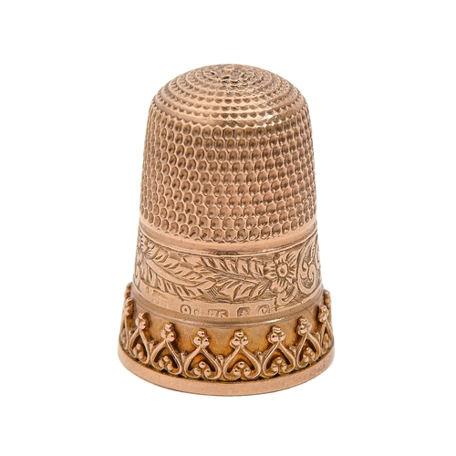 407 - A 9ct gold thimble, the skirt with applied decoration and engraved RUTH, 22mm h, maker's mark rubbed... 