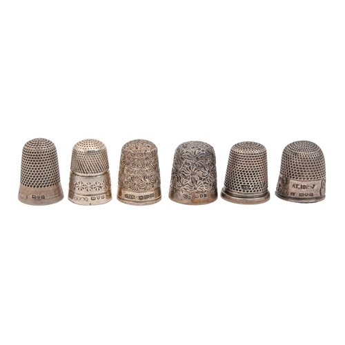 416 - Two Victorian and four Edwardian silver thimbles, various patterns including a finger shaped example... 