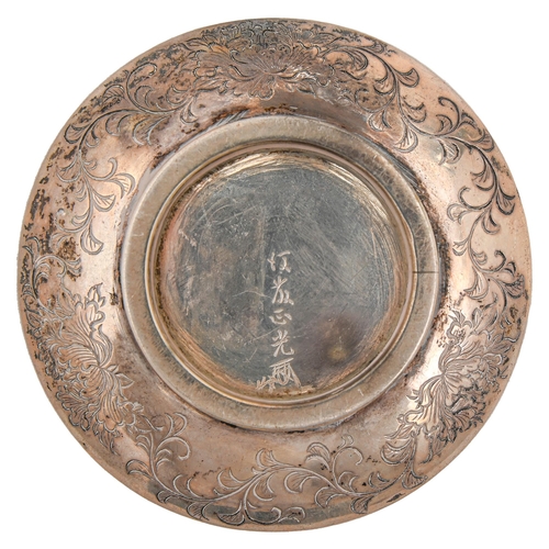 443 - A Japanese miniature silver dish, Meiji period, chased and engraved with a bird at the water margin,... 