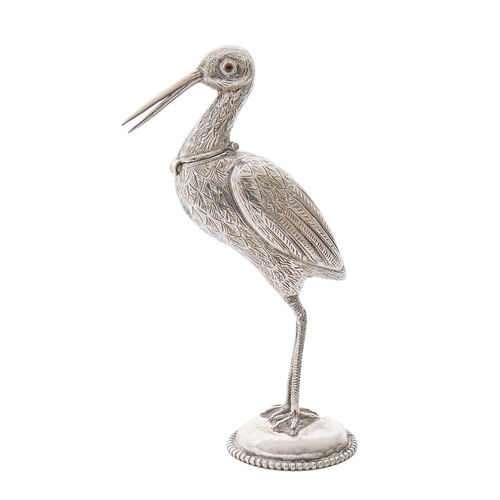 446 - A Continental stork novelty lighter, with red glass bead eyes, the head forming the cover, on domed ... 