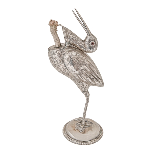 446 - A Continental stork novelty lighter, with red glass bead eyes, the head forming the cover, on domed ... 