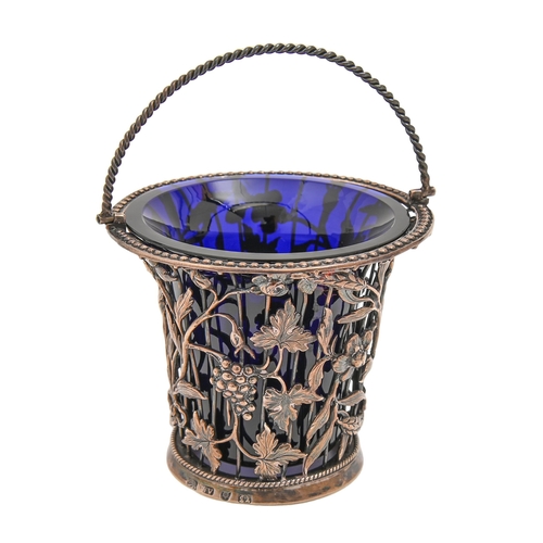 455 - A George III silver wirework cream pail, with twisted handle, of flared form applied with grapevines... 