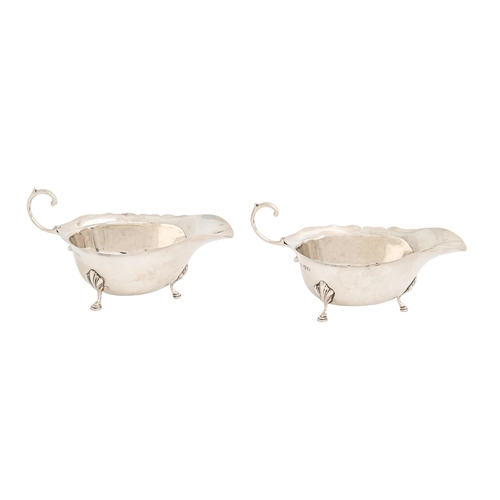 471 - A pair of George VI silver sauceboats, with flying scroll handle, 15.5cm l, by Adie Brothers Ltd, Ch... 