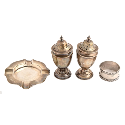 489 - A pair of Victorian vase shaped silver pepperettes, an ashtray and a napkin ring, pepperettes 10cm h... 