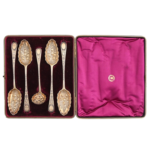 515 - A Victorian chased and parcel gilt five-piece silver 'berry' service, Old English pattern, spoons by... 