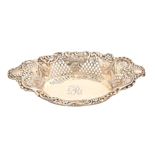 528 - A Victorian silver dish, engraved with initial R, the sides pierced with trellis and die stamped wit... 