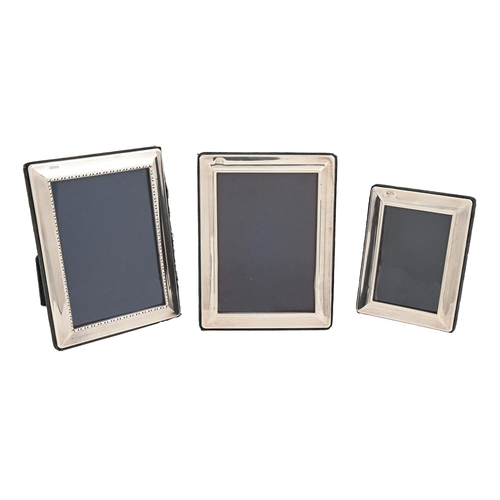 544 - Three Elizabeth II silver photograph frames, 15 x 11.5cm and smaller, by Carrs of Sheffield Ltd, 199... 