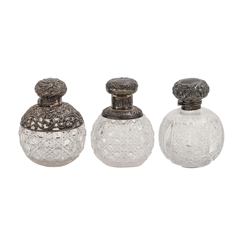 550 - One George V and two Victorian silver mounted cut glass scent bottles, with silver cap and stopper o... 