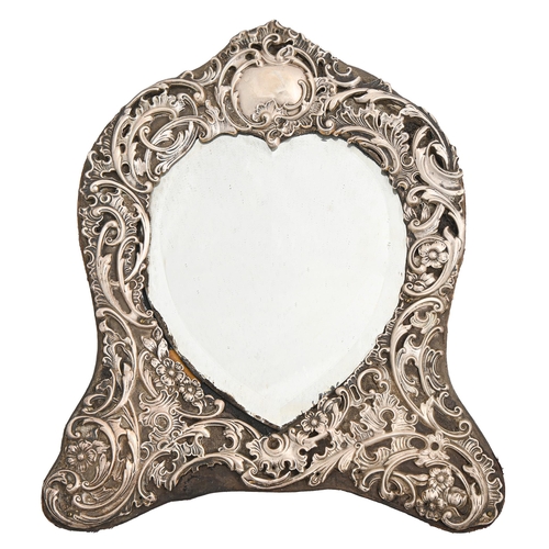 552 - An Edwardian silver heart shaped dressing mirror, with die stamped rococo mount, 30cm h, maker's mar... 