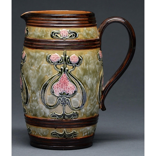 601 - A  Doulton ware Art Nouveau jug, c1905, of barrel shape and relief decorated with seed pods, 22cm h,... 