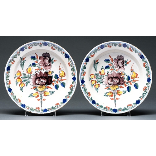 640 - A pair of Dutch Delft ware dishes, 19th c, decorated in polychrome with stylised flowers in trailing... 