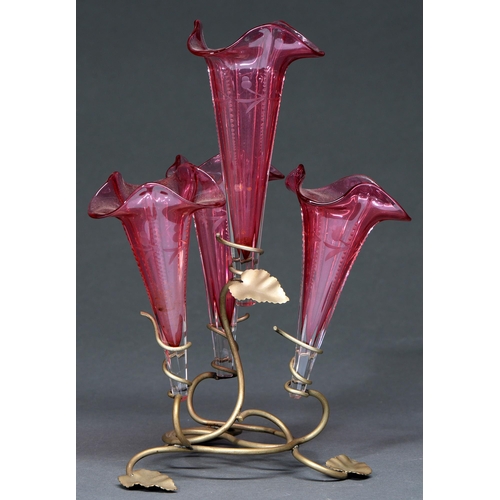 646 - A Victorian plated wirework flower stand, c1900, retaining the four cranberry glass flower holders, ... 