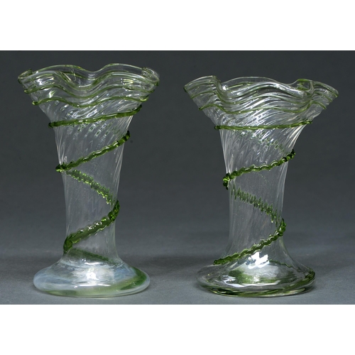 650 - A pair of Edwardian clear and green trailed spirally fluted glass vases, 23cm h