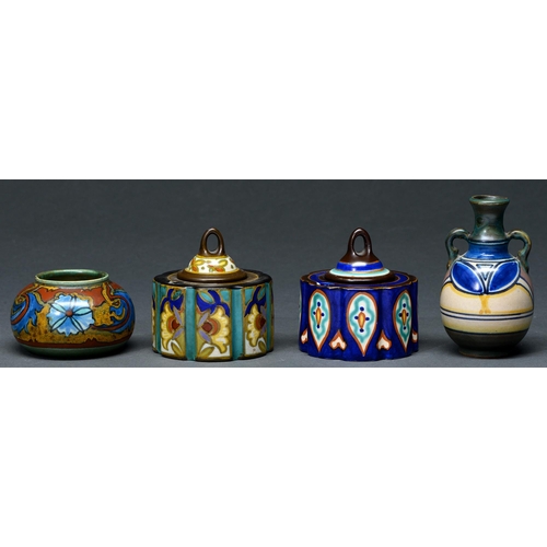 653 - Two Gouda art pottery inkwells and covers, miniature vase and a jar, first half 20th c, vase 10cm h,... 