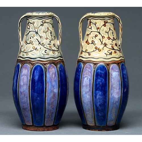 670 - A pair of Doulton ware slip cast two handed vases, 1912-c1930, 27cm h, impressed mark, incised initi... 