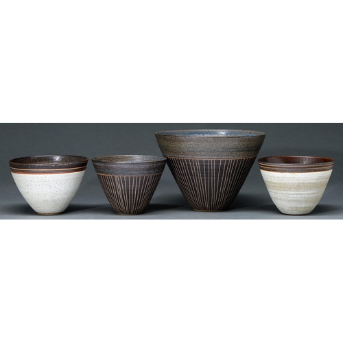 701 - Studio Pottery. Four bowls, stoneware with cream lava and raku glazes, two incised with geometric pa... 