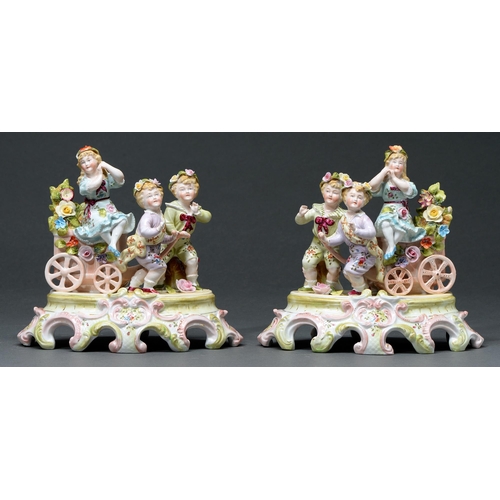 710 - A pair of German porcelain groups of three children, late 19th c, in colours, 19cm h... 