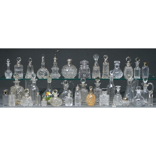 767 - A collection of silver mounted and other cut glass scent bottles, late 19th - early 20th c, includin... 