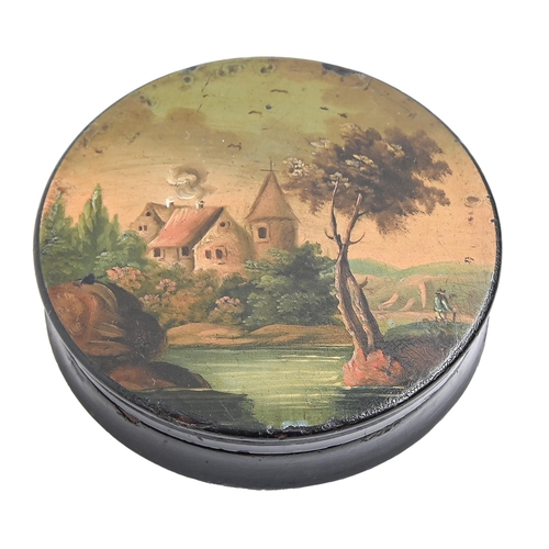 814 - A papier mache snuff box and cover, c1840, the cover painted with a man by a river, 84mm diam... 