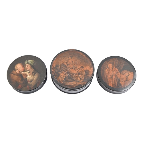 816 - A papier mache snuff box painted with a couple, another with printed lid and another, larger, 95-111... 