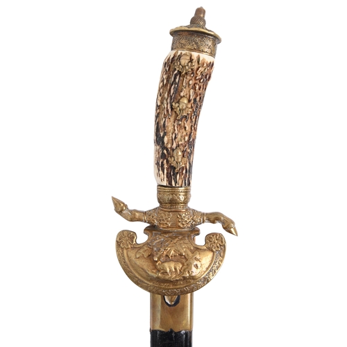 834 - A German hunting hanger and sheath, early 20th c, the blade etched with animals in the forest and at... 