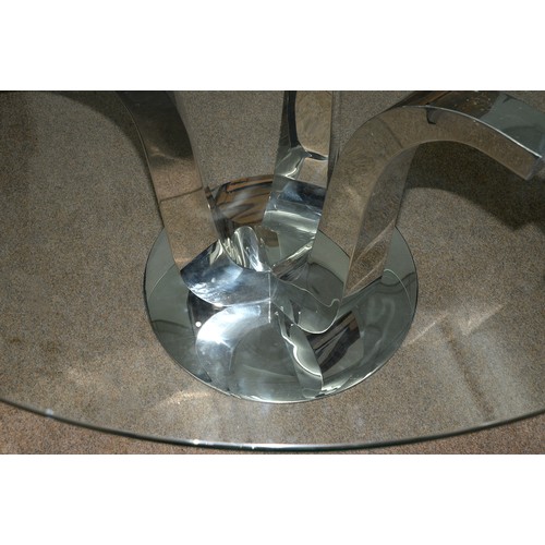 1361 - A contemporary polished metal centre table,  the round plate glass top on three upscrolled tapering ... 