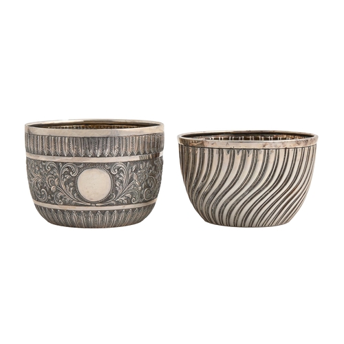 103 - Two Victorian silver sugar bowls,  spirally fluted or chased with scrolling foliage in contemporary ... 