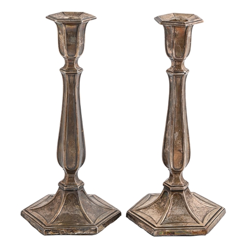 108 - A pair of George V silver candlesticks, on hexagonal foot, nozzles, 26cm h, by Adolph Scott, Sheffie... 