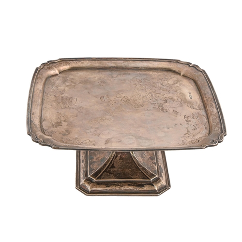 109 - A George V silver cake stand, shaped square with moulded rim, 23 x 23cm, by C W Fletcher & Son L... 