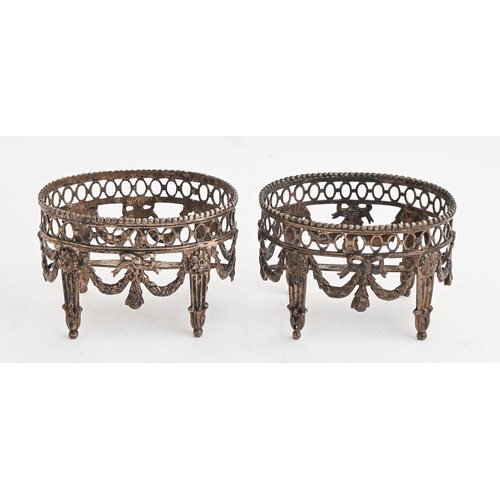 119 - A pair of Dutch oval silver salt cellars, in neo classical style, pierced gallery and festoons, on f... 