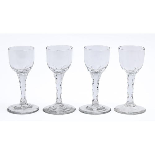 179 - Four English wine glasses, late 18th c, the round funnel bowl on faceted stem, 14.5cm hThe collectio... 