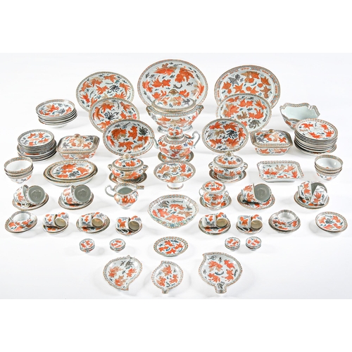 197 - A Chinese export porcelain dinner service, mid 19th c, painted with fan tailed fish in diaper border... 