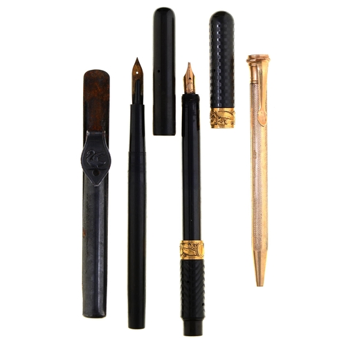 221 - A Moore's non leakable vulcanite fountain pen, engine turned, with two embossed gold collars marked ... 