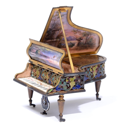 227 - A French musical giltmetal and enamel trinket box in the form of a grand piano, c1900, the lid paint... 