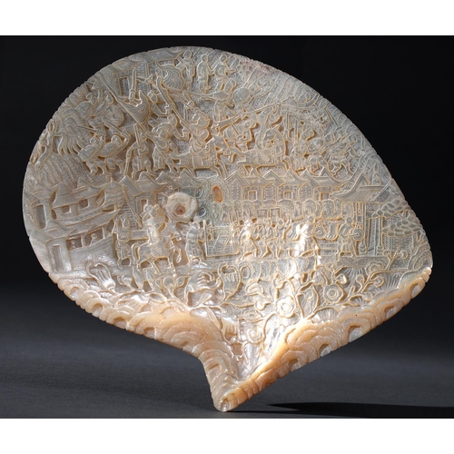 232 - A Chinese carved shell, mid 19th c, intricately worked with scenes of battle and buildings, 22cm lTh... 