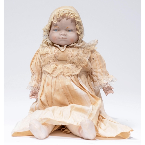 254 - A Continental character bebe doll, late 19th c, the bisque shoulder-head with moulded hair on padded... 