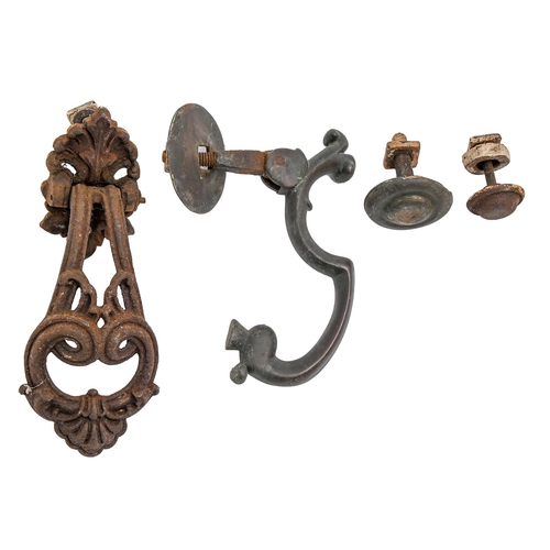 263 - A Victorian brass door knocker and stud, 20cm h and a later Victorian ornate cast iron door knocker ... 